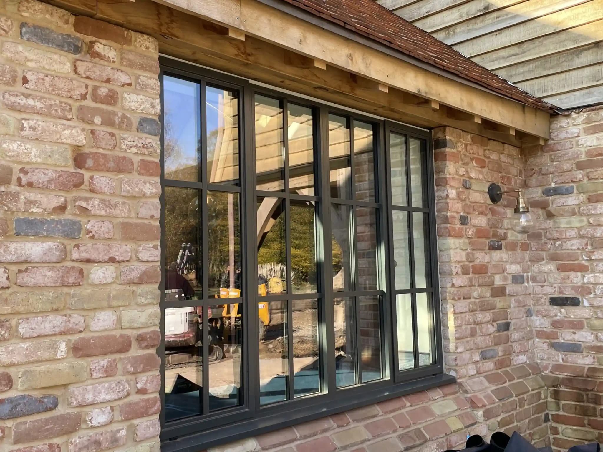 Architect-designed modern home featuring black aluminium windows with thermal break technology - installed by Harrington Windows