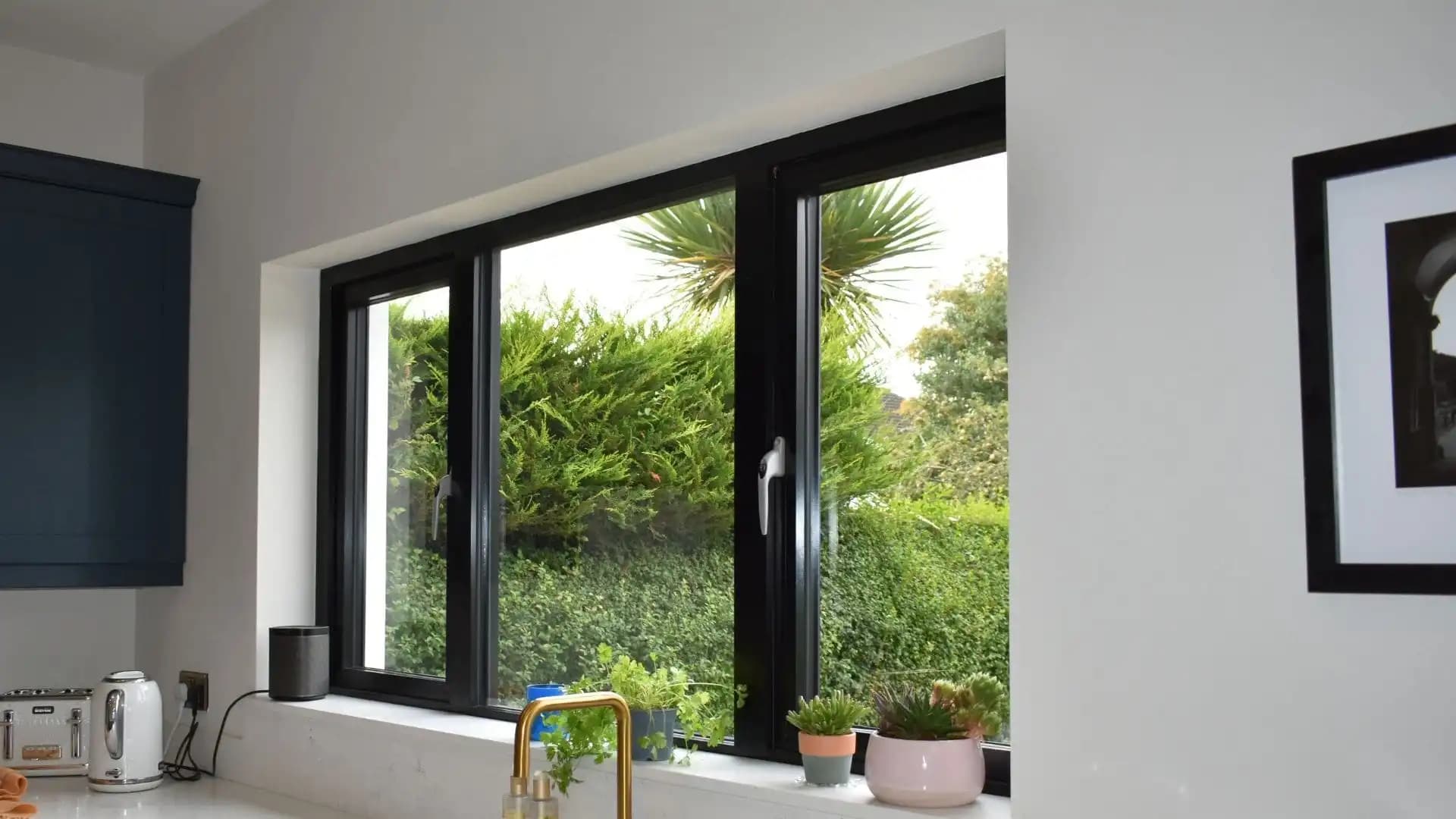 Architectural home featuring custom-shaped aluminium windows with RAL color finish demonstrating design versatility and bespoke manufacturing capabilities