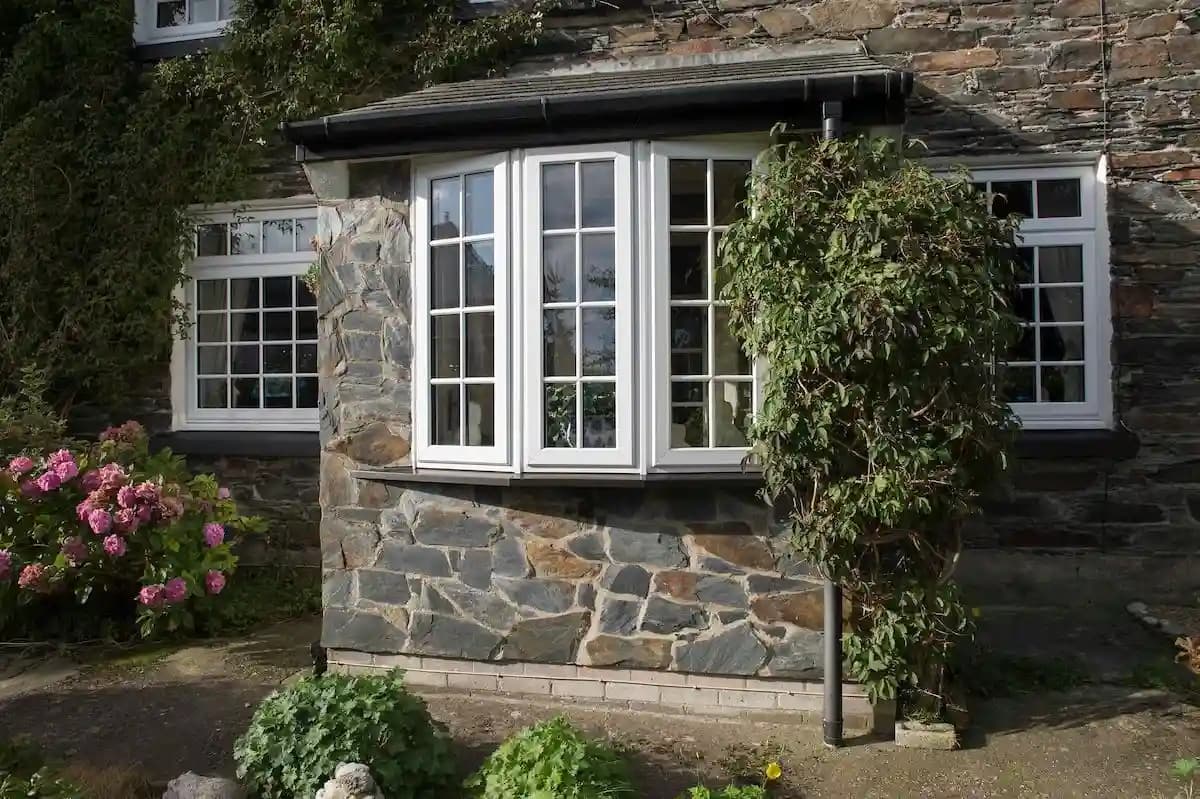 Contemporary bay window with clean lines providing panoramic garden views