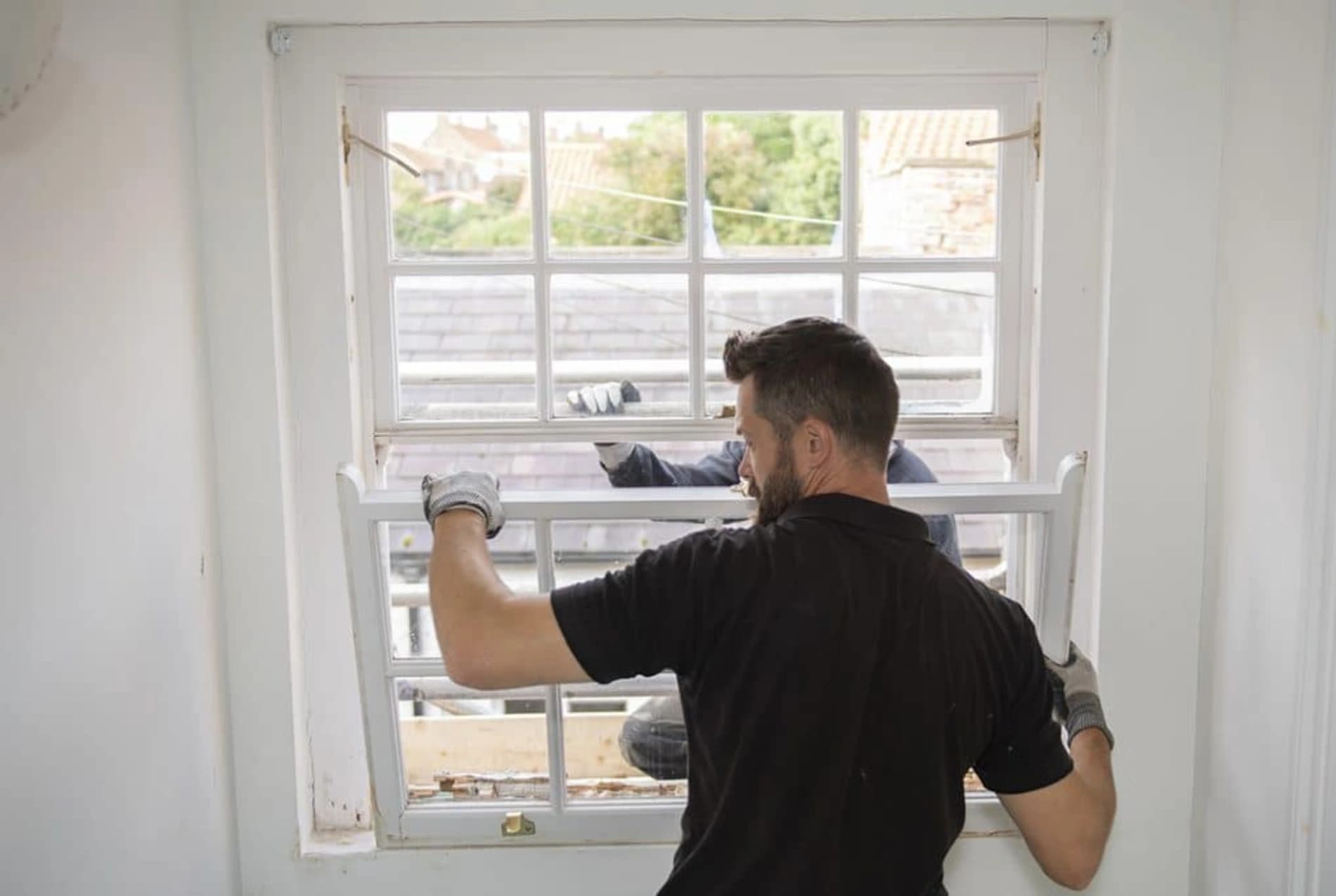 Harrington craftsmen installing windows with precision