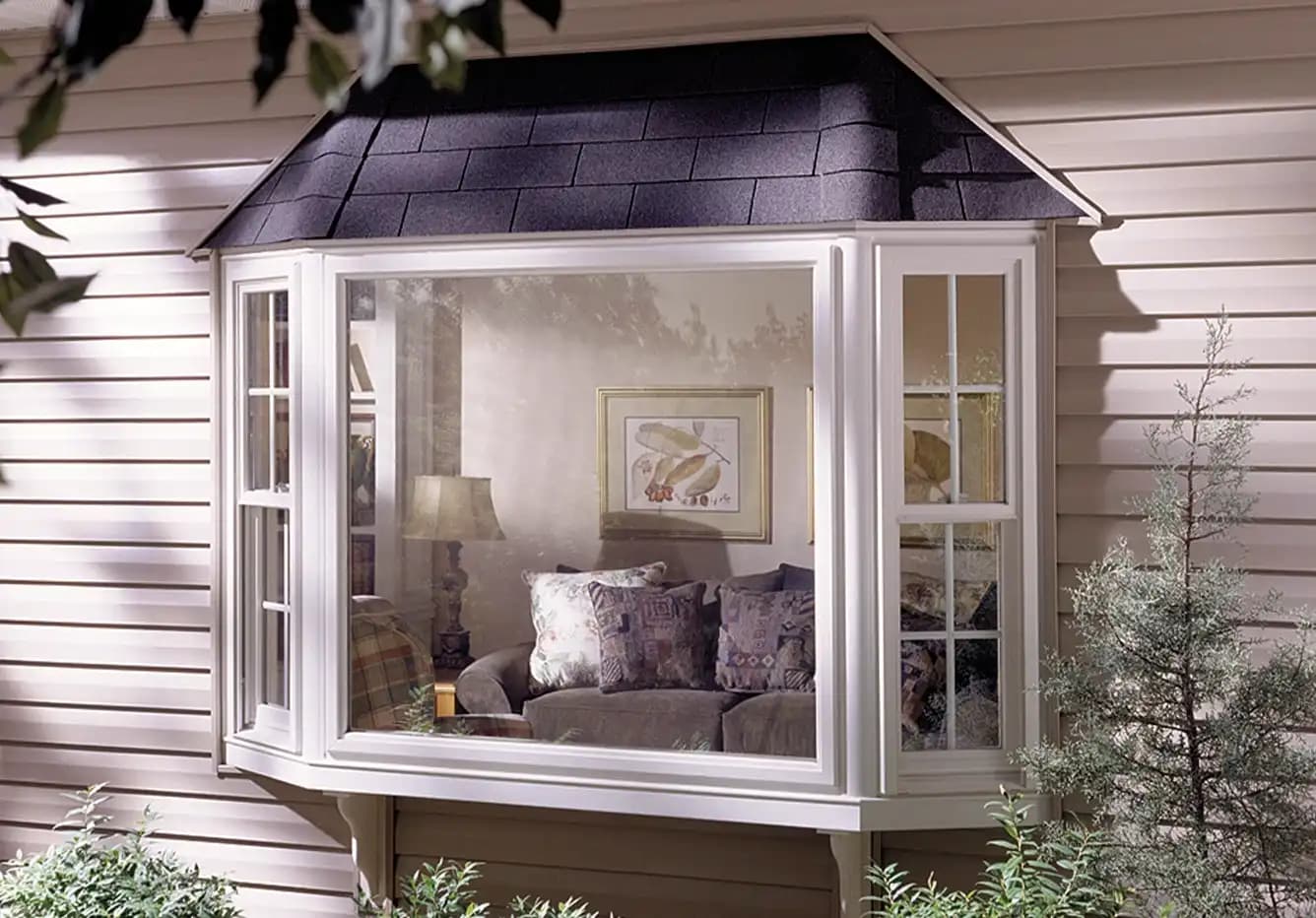 Bay window creating additional interior living space with comfortable seating area