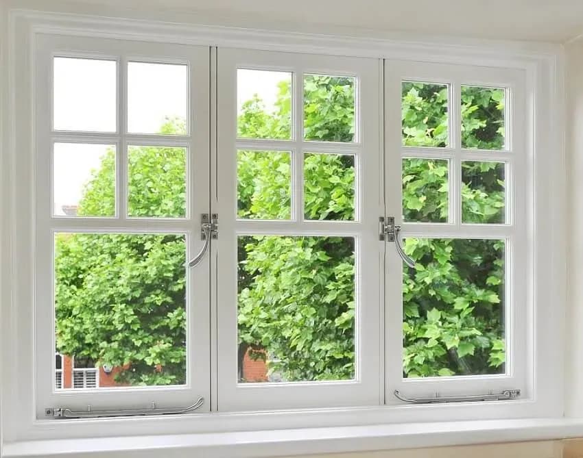 Exterior view of property showing variety of double glazed window styles including casement, sash, and bay designs