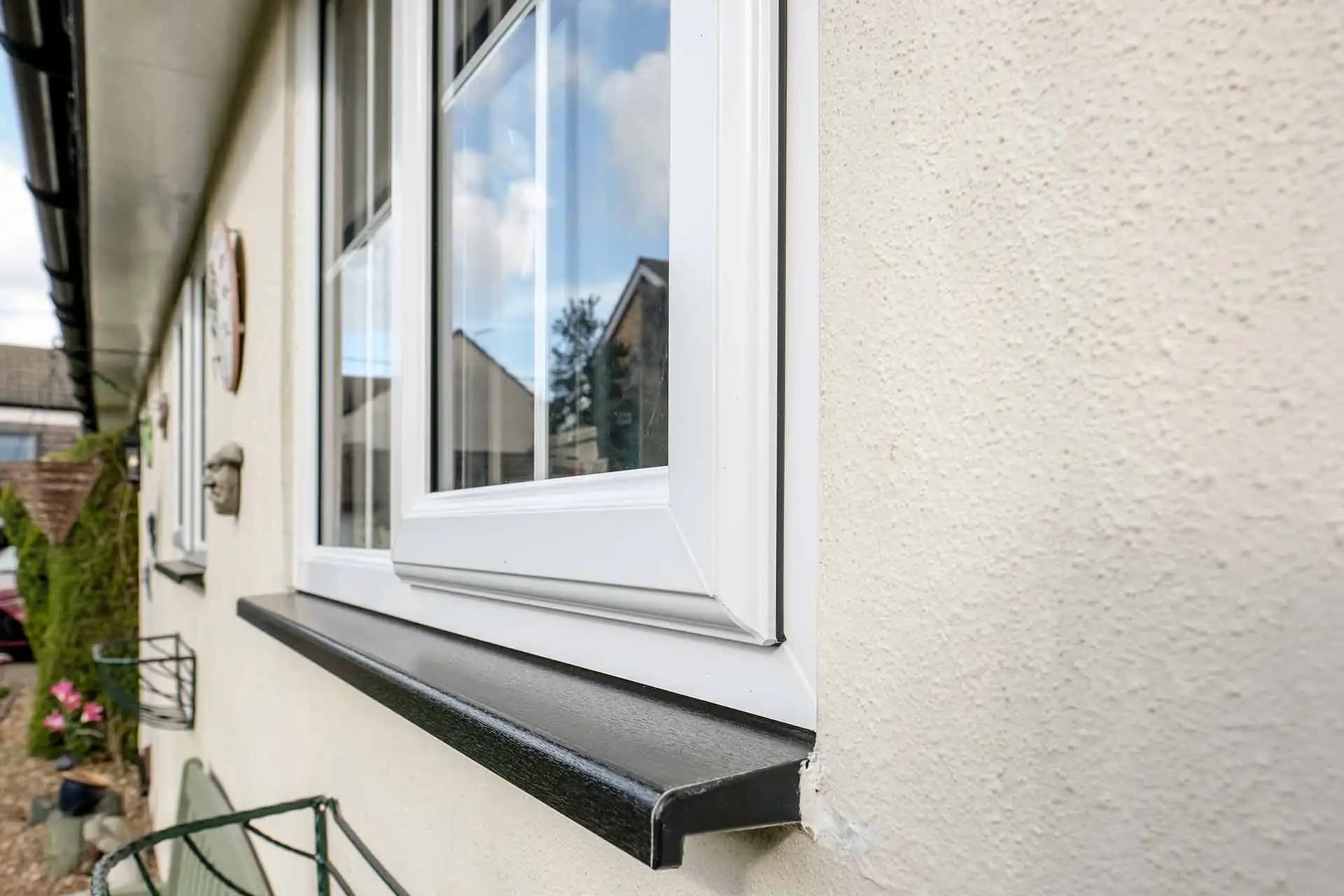 Thermal imaging comparison showing superior heat retention of a home with triple glazed windows versus standard glazing
