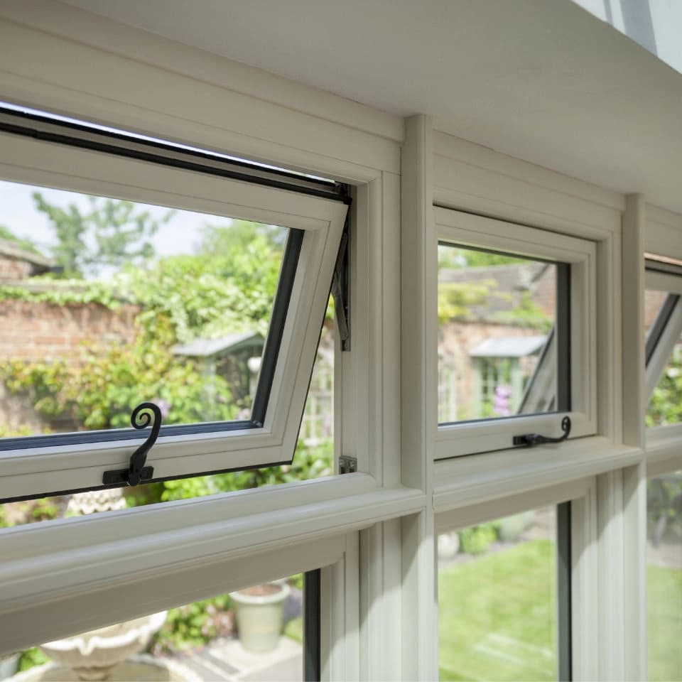 Living room with triple glazed windows showing enhanced acoustic insulation properties for noise reduction